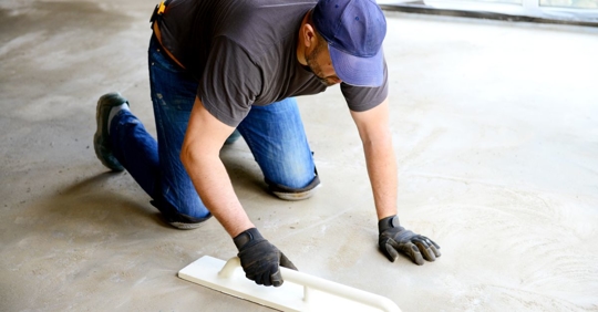 man polishing concrete flooring